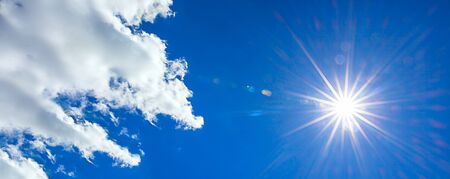 panorama with sun shines in a blue sky with cloud. hot summer weather panoramic view sky