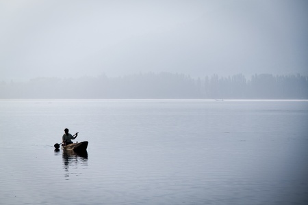 Man paddling at sunriseの写真素材