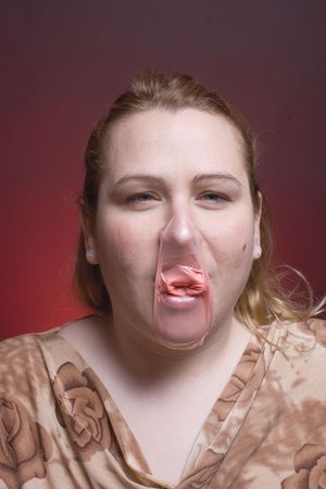 Women with burst bubble gumの写真素材