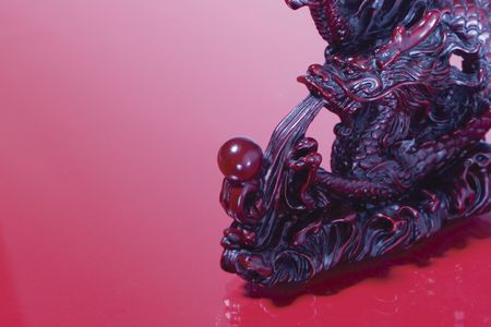 Chinese red dragon statue spitting waterの写真素材