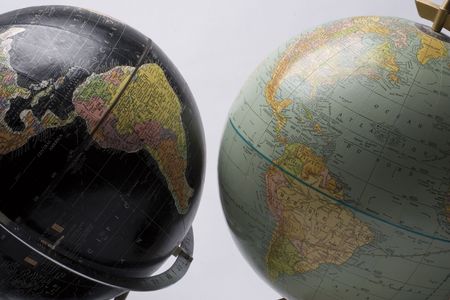 A dark globe facing a light globe showing americaの写真素材