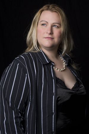 Portrait of a thirty something overweight women in evening clothesの写真素材