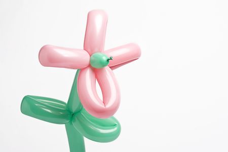 Balloon flower with pink balloon for petals and green balloon for stem and leavesの写真素材