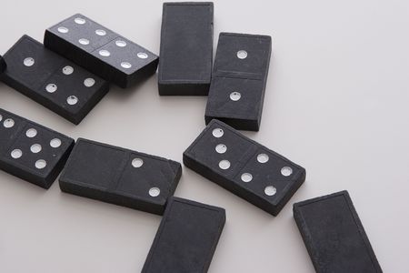 array of dominos fallen on a tableの写真素材