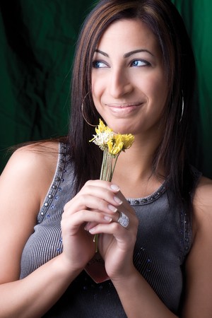 Twenty something fashion model holding dry flowerの写真素材