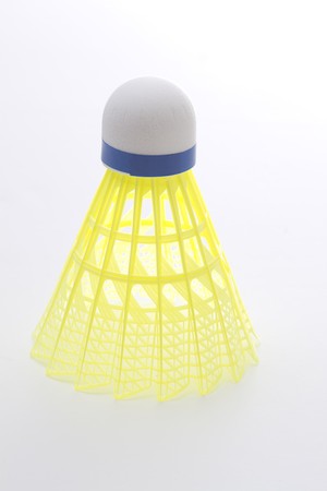 shuttlecock with yellow base in perfect form standing uprightの写真素材