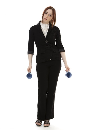 Young business woman with two empty cup of coffee against white backgroundの写真素材