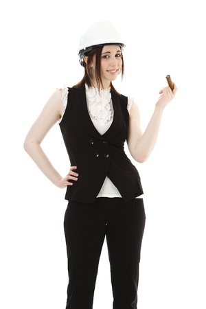 Young business woman wearing a business suit and construction smoking a cigar against a white background の写真素材