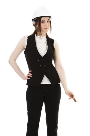 Young business woman wearing a business suit and construction smoking a cigar against a white background の写真素材