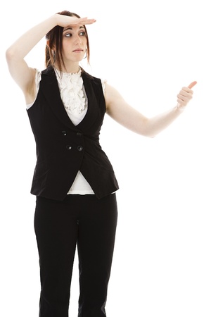 Young business woman with her thumb out and searching the horizon against white backgroundの写真素材