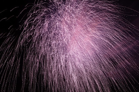 Firework display against black sky