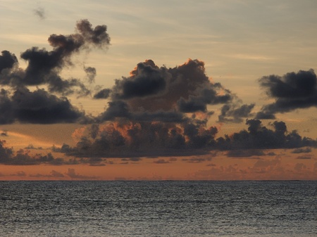 View of a sunrise, on a cloudy day, over the atlantic oceanの写真素材