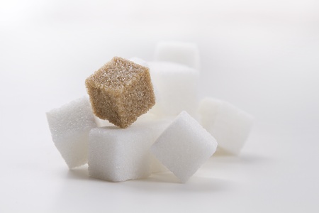 stack of white sugar cube with one brown sugar cubeの写真素材