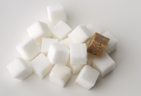 stack of white sugar cube with one brown sugar cubeの写真素材
