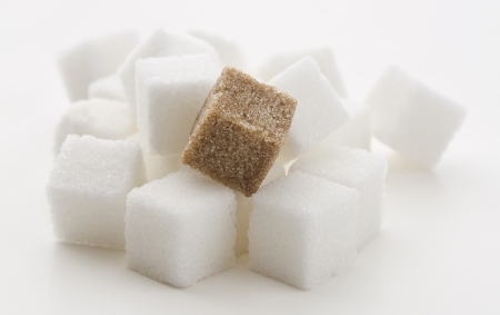 stack of white sugar cube with one brown cubeの写真素材