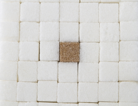 closely pack white sugar square with one brown square in the middleの写真素材