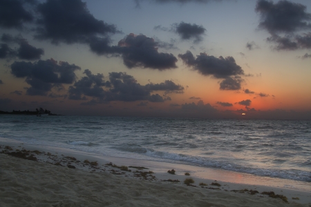 Sun rising over a beachの写真素材