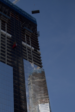 Freedom tower under construction against a blue skyの写真素材