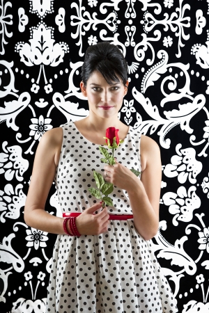 young woman in front of a black and white textured background with 60の写真素材