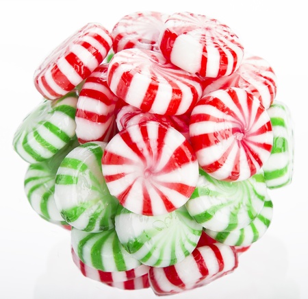hard red, green and white candy mints stuck in a ballの写真素材