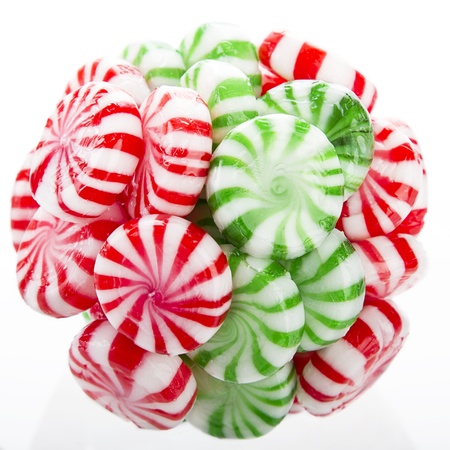 hard red, green and white candy mints stuck in a ballの写真素材