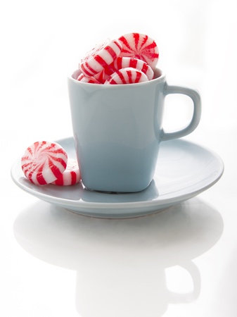 small blue coffee cup with red and white swirl mintの写真素材