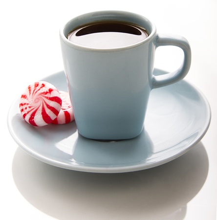 small blue coffee cup with red and white swirl mintの写真素材