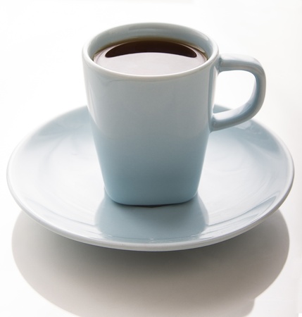 small light blue coffee cup against a white backgroundの写真素材