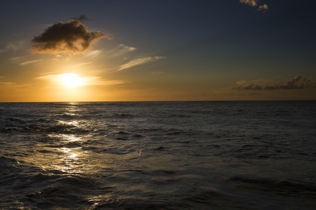 Sunset over a calm pacific oceanの写真素材