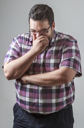 Young man holding a laugh inの写真素材