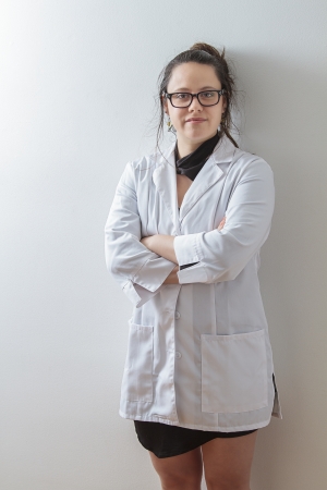thirtie something brunette woman wearing a lab coatの写真素材