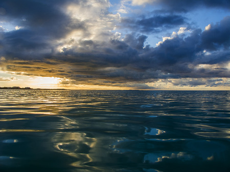 Sun setting over the Atlantic oceanの写真素材