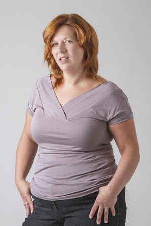 forty something overweight woman with a disgusted lookの写真素材