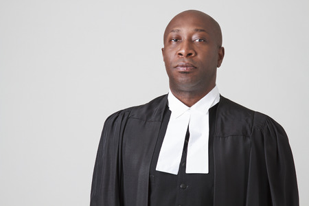 Bald black man wearing a judicial togaの写真素材