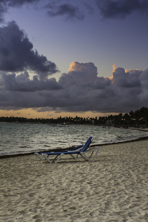 two resort beach chair on the beach at sunriseの写真素材