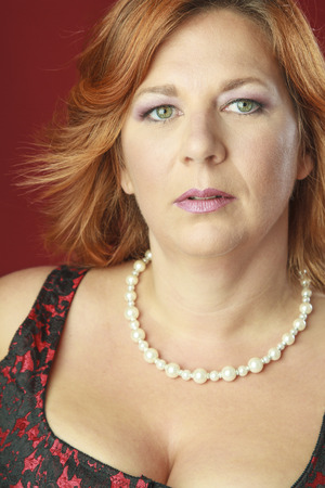 Close up portrait of a red hair woman with green eyesの写真素材