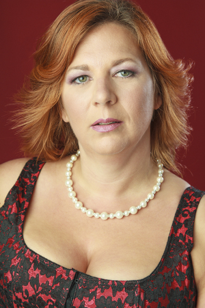 Close up portrait of a red hair woman with green eyesの写真素材