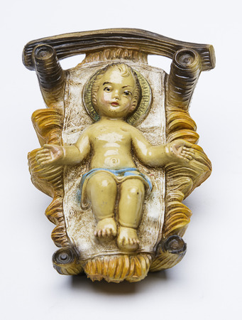 vintage figure of a baby jesus of the christmas nativity sceneの写真素材