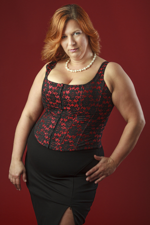 sensual forty year old woman in red corsetの写真素材