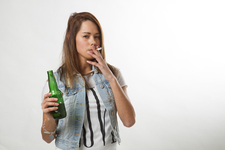 underage girl smoking and drinkingの写真素材