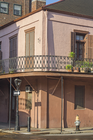 Pink house on a street corner of New Orleansの写真素材