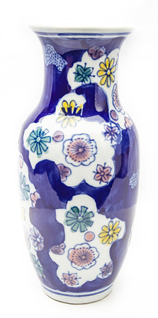 Vase painted with flower pattern againt a white backgroundの写真素材
