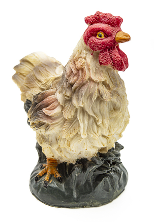 Isolated chicken figurine on a white backgroundの写真素材