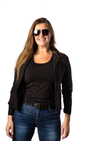 Forty year old woman, wearing sunglasses and a sport jacket, isolated on a white backgroundの写真素材
