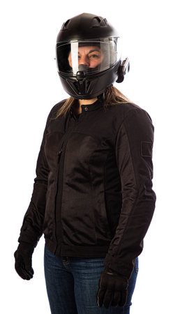 Forty something woman wearing a black motorcycle coat and black helmet against a white backgroundの写真素材