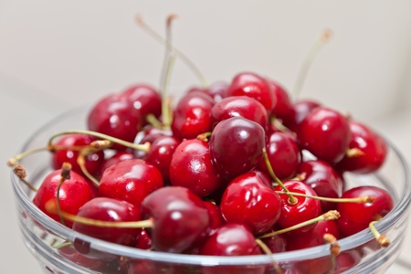 Ripe sweet cherry in a glass cupの写真素材
