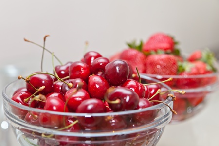 Red strawberry and ripe sweet cherryの写真素材