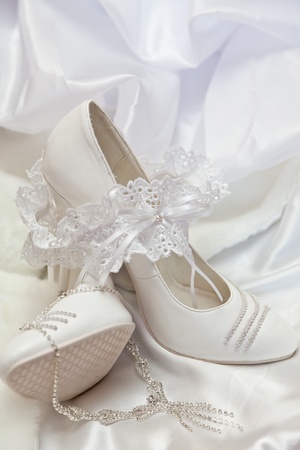 Wedding shoes, garter and costume jewelleryの写真素材