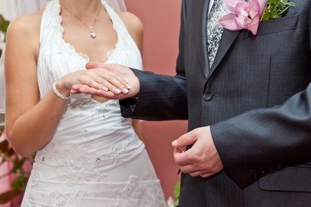 Hand of the bride in a hand of the groomの写真素材
