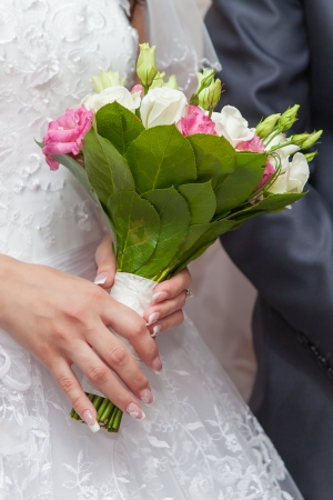 Wedding bouquet in hands of the brideの写真素材